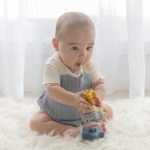 Baby playing with silicone star tower stacker