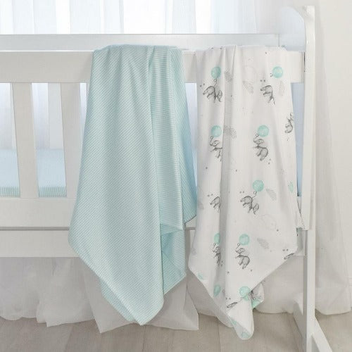 jersey muslin wraps draped over a cot