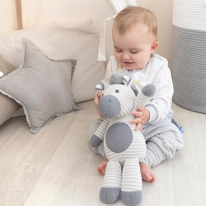 baby with knitted toy zebra