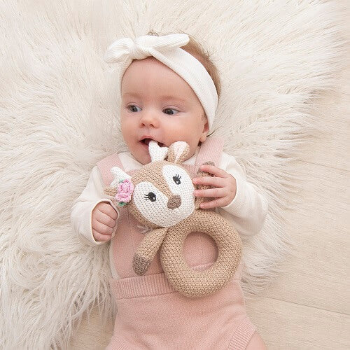 baby with fawn knit ring rattle