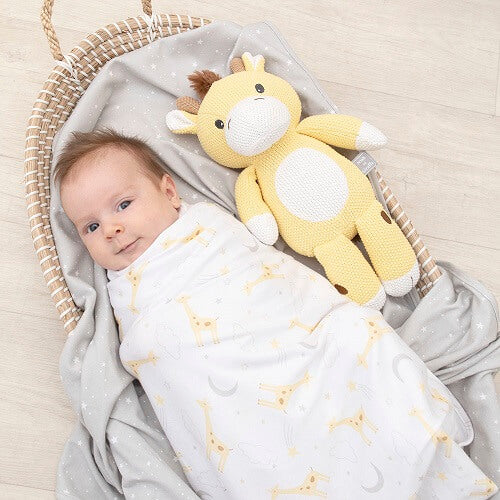 baby-swaddled-with-knit-giraffe-toy