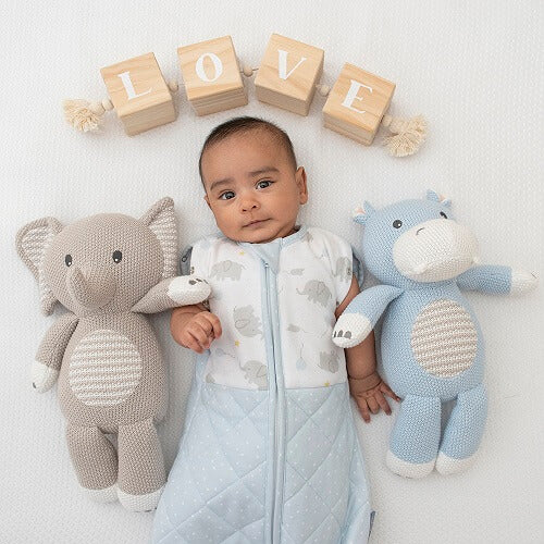 baby with hippo and elephant knitted toy