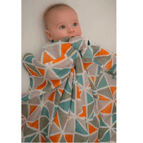 baby with mutli triangle muslin wrap